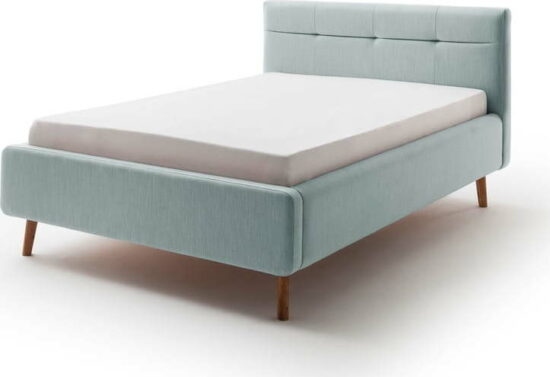 Modrá čalouněná dvoulůžková postel s úložným prostorem a s